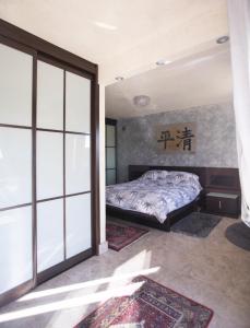 a bedroom with a bed and a sliding glass door at Chalet asosado in Almerimar +35 photos