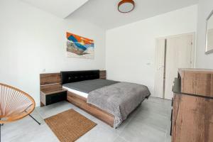 A bed or beds in a room at SKi&bike apartments Laguna Zarzecze