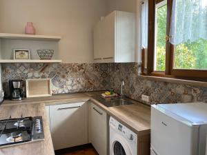 A kitchen or kitchenette at Villa Soghetta Typ S3