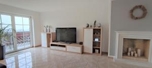 TV a/nebo společenská místnost v ubytování Ferienwohnung Rhöner WeitBlick