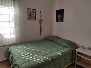 Ένα ή περισσότερα κρεβάτια σε δωμάτιο στο Casa ubicación privilegiada