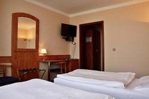 Voodi või voodid majutusasutuse Hotel Cernigov toas