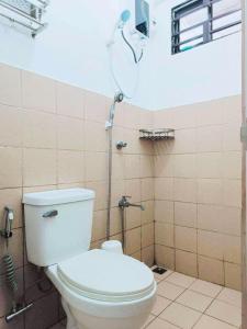 a bathroom with a toilet and a shower at 1 - Affordable Family Place to Stay In Cabanatuan in Cabanatuan