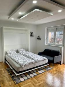 Säng eller sängar i ett rum på Apartman Otoria