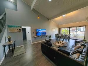 a large living room with a couch and a table at Canal view getaway in Newport in Scarborough