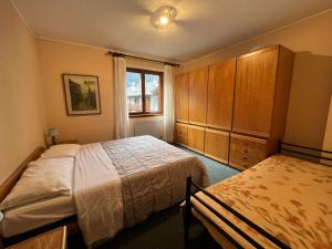 Postel nebo postele na pokoji v ubytování San Luigi - Rooms & Apartments