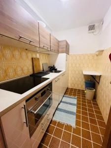 Kuchyň nebo kuchyňský kout v ubytování San Luigi - Rooms & Apartments