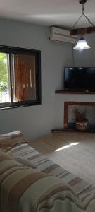 TV a/nebo společenská místnost v ubytování CASA NUEVA