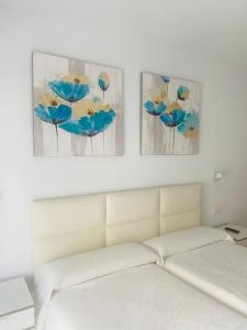 Postel nebo postele na pokoji v ubytování Hostal Tres Soles