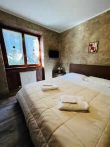 Postel nebo postele na pokoji v ubytování San Luigi - Rooms & Apartments