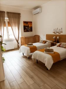 a bedroom with two beds in a room at Luxury Beach House in Torvaianica