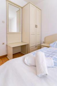 Кровать или кровати в номере Pansion Lavanda Lopar