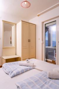Кровать или кровати в номере Pansion Lavanda Lopar