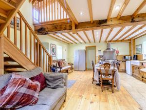 a living room with a couch and a table at Sir Francis Bigod - Uk31993 in Staithes