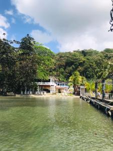 a house on the shore of a body of water at Villa Bella in Portobelo