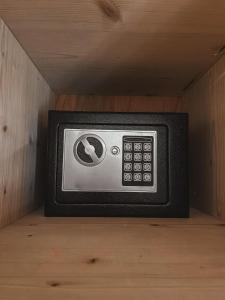 a small television sitting in a corner of a room at Villa Olga studios in Nea Skioni +102 photos