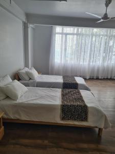 Ένα ή περισσότερα κρεβάτια σε δωμάτιο στο Bedz