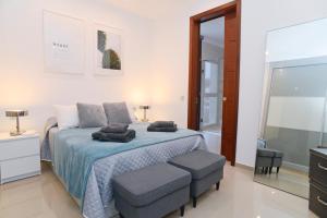 Postel nebo postele na pokoji v ubytování Luxury Villa Punta Mujeres