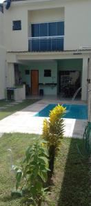 a house with a swimming pool in the yard at Casa Griebeler 01 in Rio de Janeiro