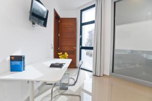 TV a/nebo společenská místnost v ubytování Luxury Villa Punta Mujeres
