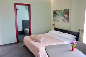 Postel nebo postele na pokoji v ubytování Le Tre Punte B&B