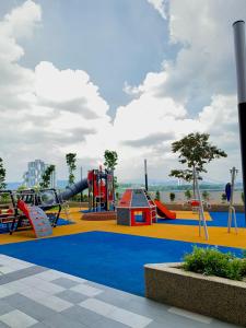 a park with a playground with a slide at Sheera Islamic Homestay 2r2bathroom Free Wifi with tv channels Netflix Coway Water in Cheras