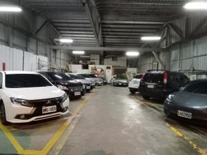 a garage with a bunch of cars parked in it at Shinge Hotel in Hualien City