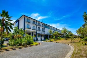 a building with a road in front of it at Gazelle International Hotel in Kokopo