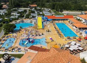 an overhead view of a water park with two pools at mobilhome 741 Les Charmettes in Les Mathes