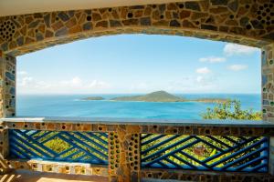 a window view of the ocean from a villa at Aleli Cottages in Culebra