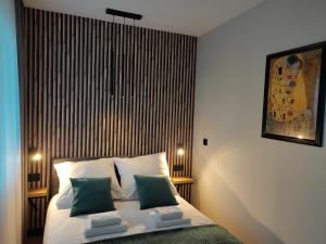 Posteľ alebo postele v izbe v ubytovaní Apartament Zamkowe Wzgórze