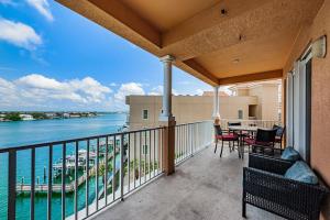 a balcony with a view of the water at Gorgeous Getaway in Clearwater Beach