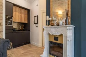 A kitchen or kitchenette at CH Elvira Luxury Apartment
