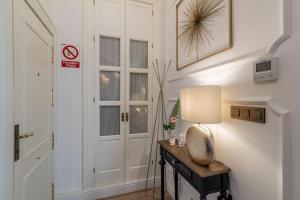 A bed or beds in a room at CH Elvira Luxury Apartment