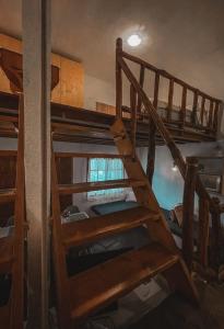 a staircase in a room with bunk beds at Villa Olga studios in Nea Skioni