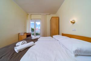 Кровать или кровати в номере Apartments Stare Brajde