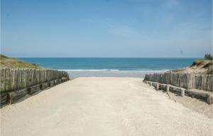 a dirt road leading to the ocean on a beach at Amazing Home In Saint-Vivien-De-Medoc in Saint-Vivien-de-Médoc