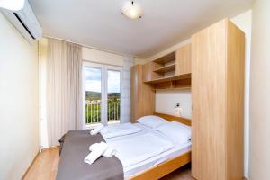 Кровать или кровати в номере Apartments Stare Brajde