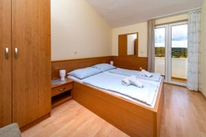 Кровать или кровати в номере Apartments Stare Brajde