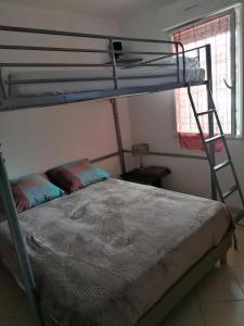 Posteľ alebo postele v izbe v ubytovaní Appartement Résidence Les Eucalyptus