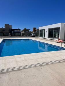 a large swimming pool on top of a building at Patagonia II in Puerto Madryn