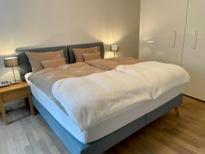 Ein Bett oder Betten in einem Zimmer der Unterkunft Tertianum Parkresidenz Meilen