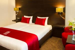 Postel nebo postele na pokoji v ubytování Van der Valk Hotel Avifauna