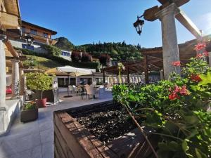 a view of a patio with tables and chairs at Casa Carlotta in Tignale