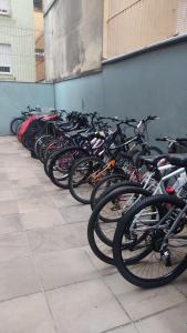 a row of bikes lined up against a wall at Cidade Baixa Apart Studio Encantador in Porto Alegre