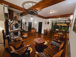 a living room with wooden furniture and a table at Chez Allen in Nuwara Eliya