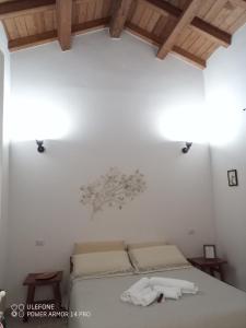 Giường trong phòng chung tại S'Incontru Affittacamere