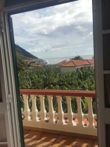 a view of the ocean from a balcony at Casa MAR in Madalena do Mar