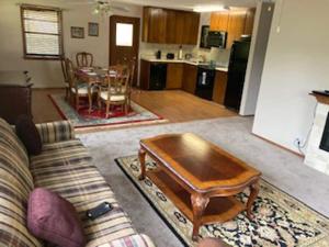 a living room with a couch and a coffee table at Lake Texoma lake house in Shay
