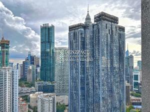 a group of tall buildings in a city at Scarletz Suites by Edenzpace @ KLCC Area in Kuala Lumpur